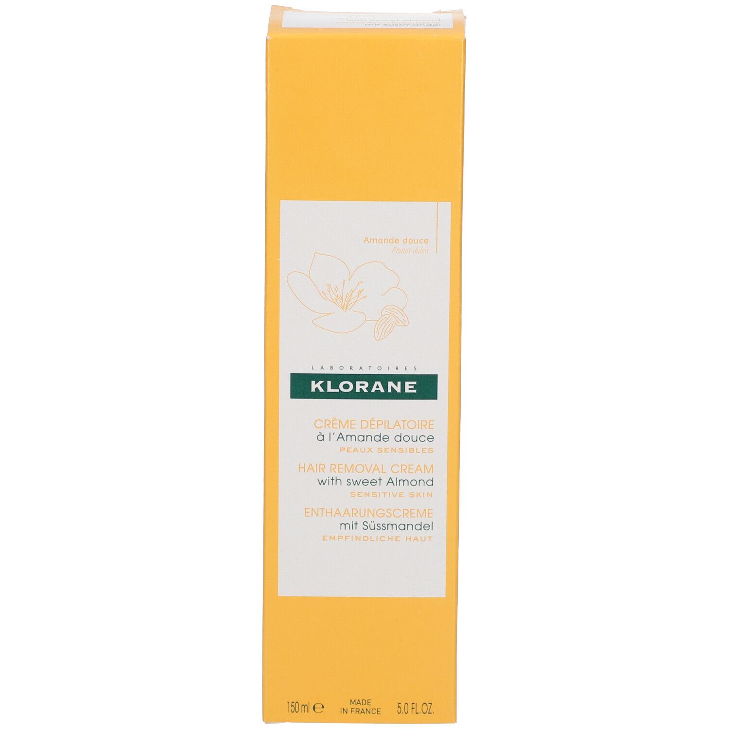 Gelbe Schachtel. Aufschrift: KLORANE, Crème dépilatoire à l'Amande douce, Hair Removal Cream, Enthaarungscreme mit Süßmandel. Produktverpackung.