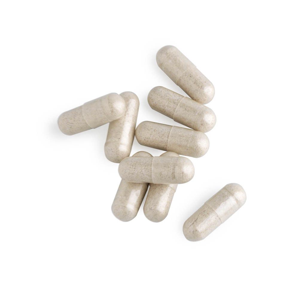 Tas de 9 gélules. Forme beige, oblongue.
