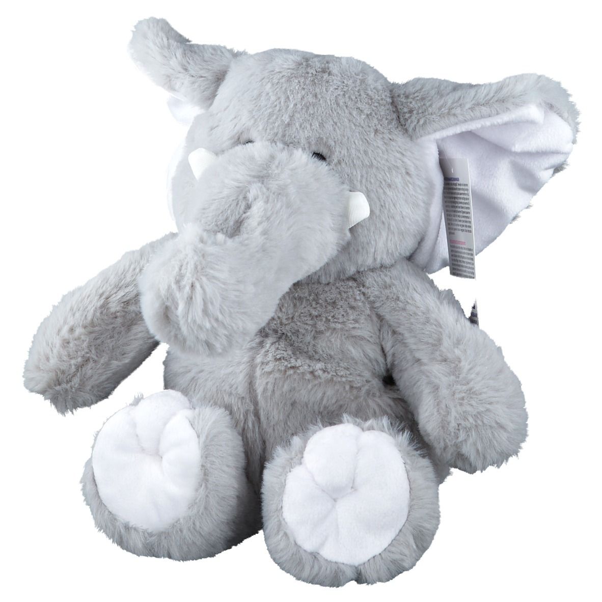 Grauer Plüsch-Elefant mit weißen Ohren und Füßen. Ein Etikett ist befestigt.