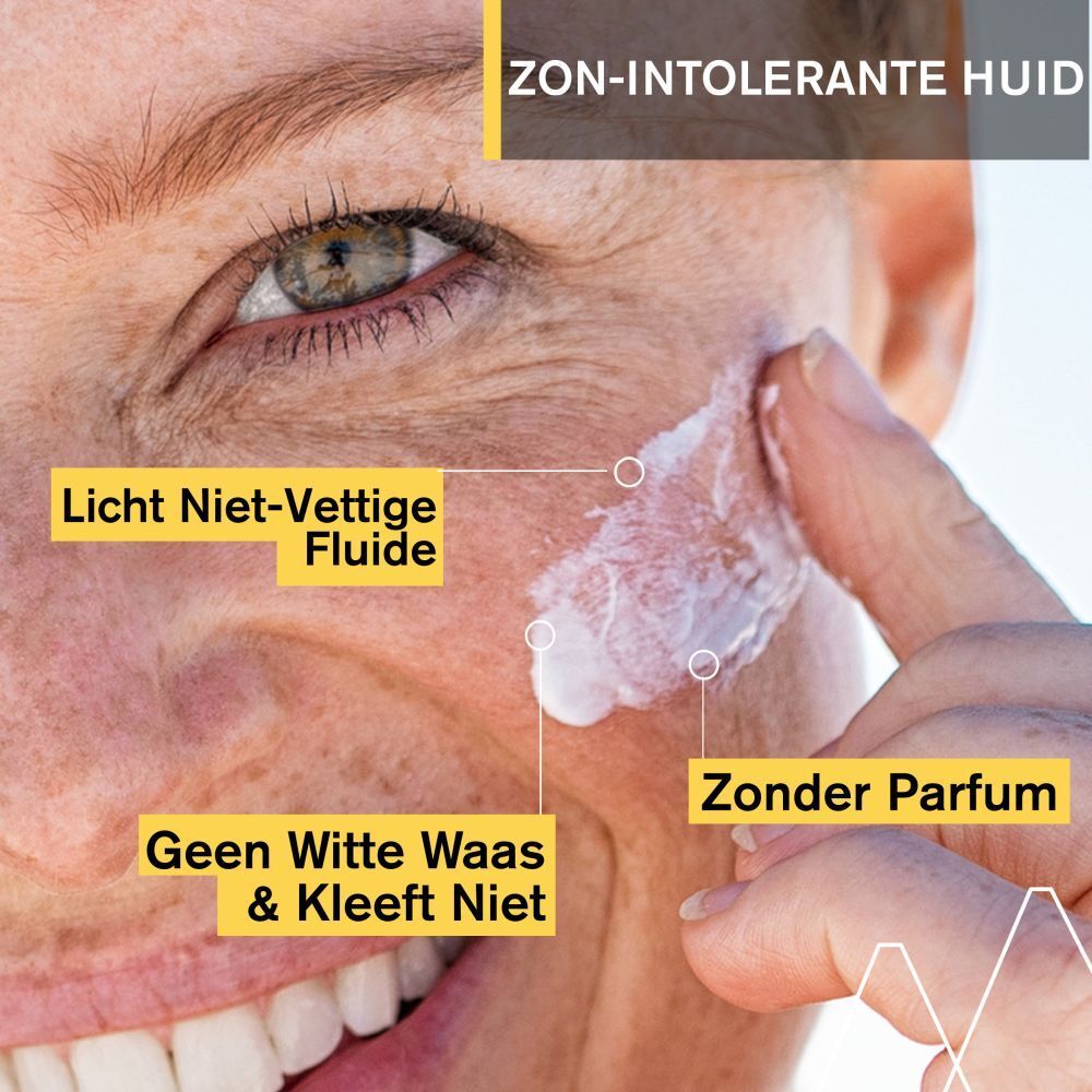 Achterkant witte fles URIAGE Bariésun 100 Fluid. Meertalige tekst. 50ml.