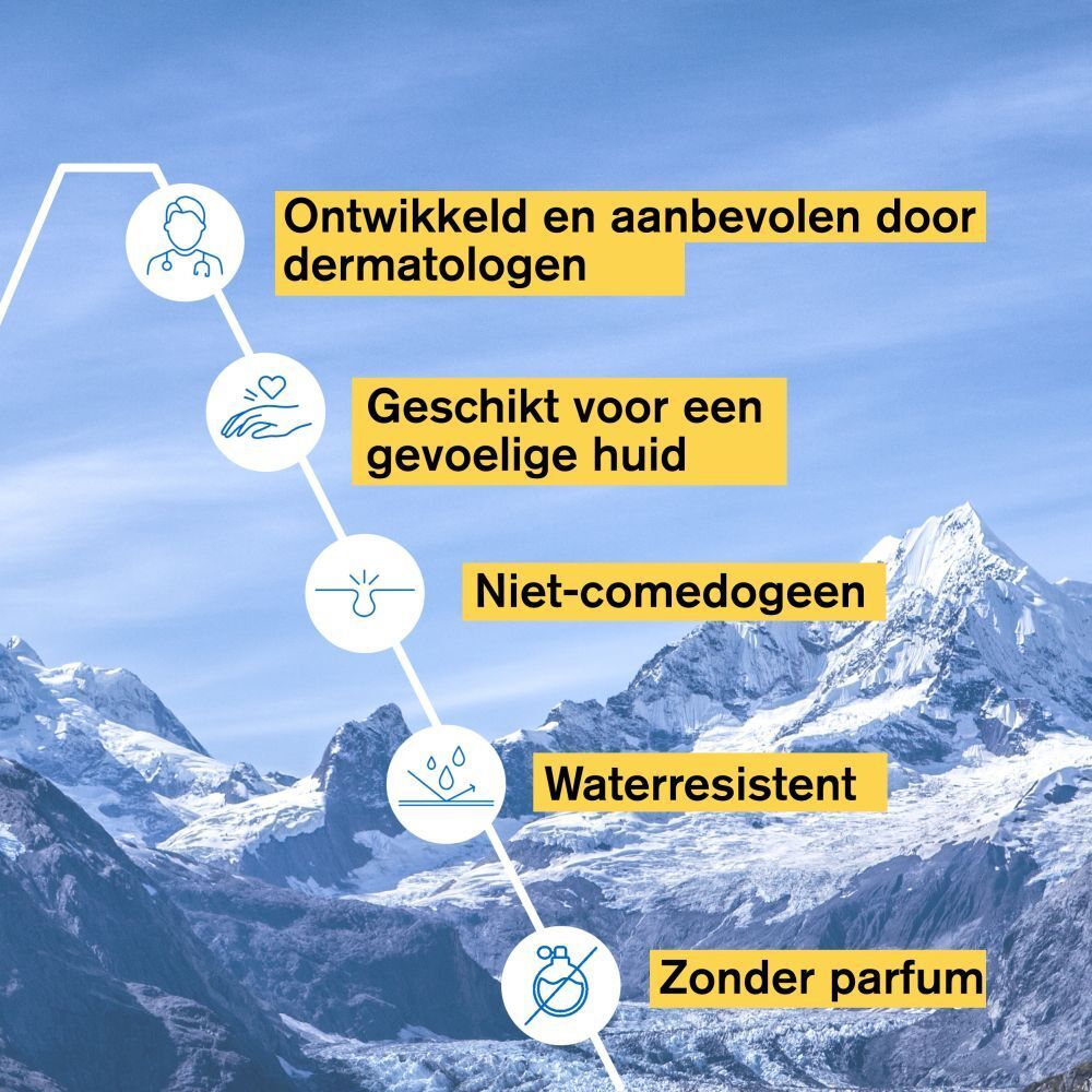Achterkant witte fles URIAGE Bariésun 100 Fluid. Meertalige tekst. 50ml.
