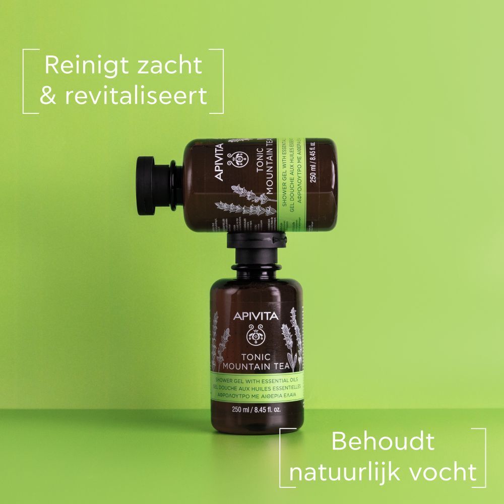 Twee flessen, de ene op de andere. Opschrift: APIVITA, Tonic Mountain Tea. Tekst: Reinigt zacht & revitaliseert.