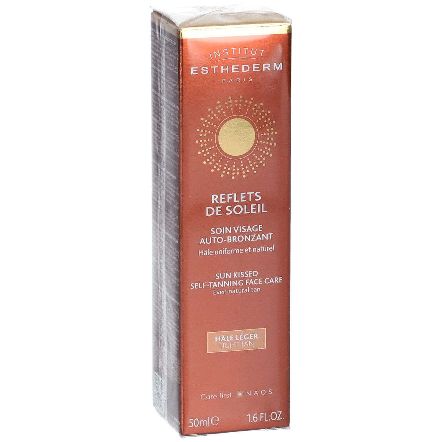 Boîte marron avec informations produit. Inscriptions: INSTITUT ESTHEDERM PARIS, REFLETS DE SOLEIL, SOIN VISAGE AUTO-BRONZANT.