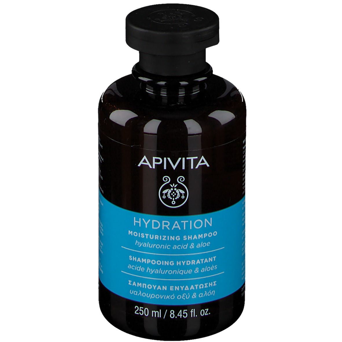 Flacon marron, bouchon noir. Inscription APIVITA HYDRATION Shampoo. Étiquette bleue avec texte. 250 ml.