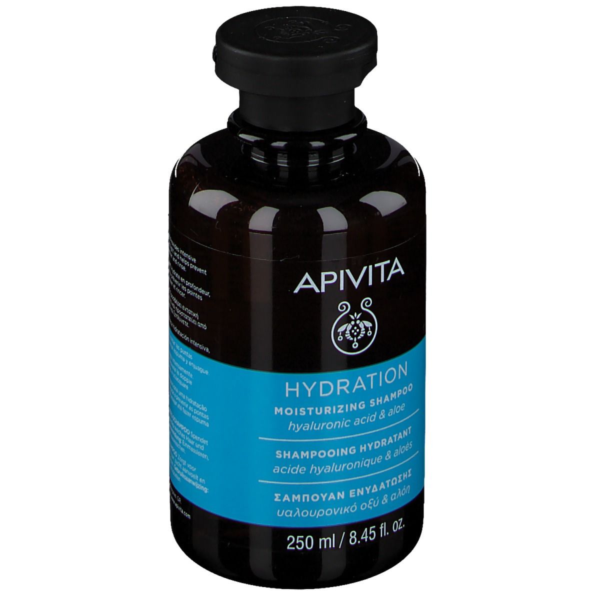 Flacon marron, bouchon noir. Inscription APIVITA HYDRATION Shampoo. Étiquette bleue avec texte. 250 ml.