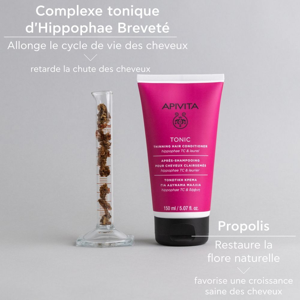 Tube rose avec bouchon noir, à côté d'une éprouvette. Texte : Hippophae.