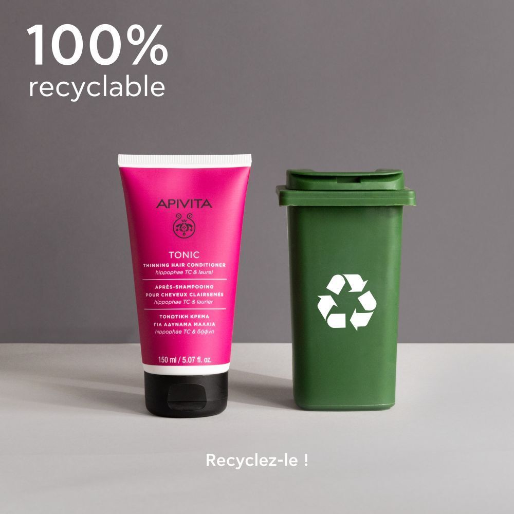 Tube rose avec bouchon noir à côté d'une poubelle verte. Texte : 100% recyclable.