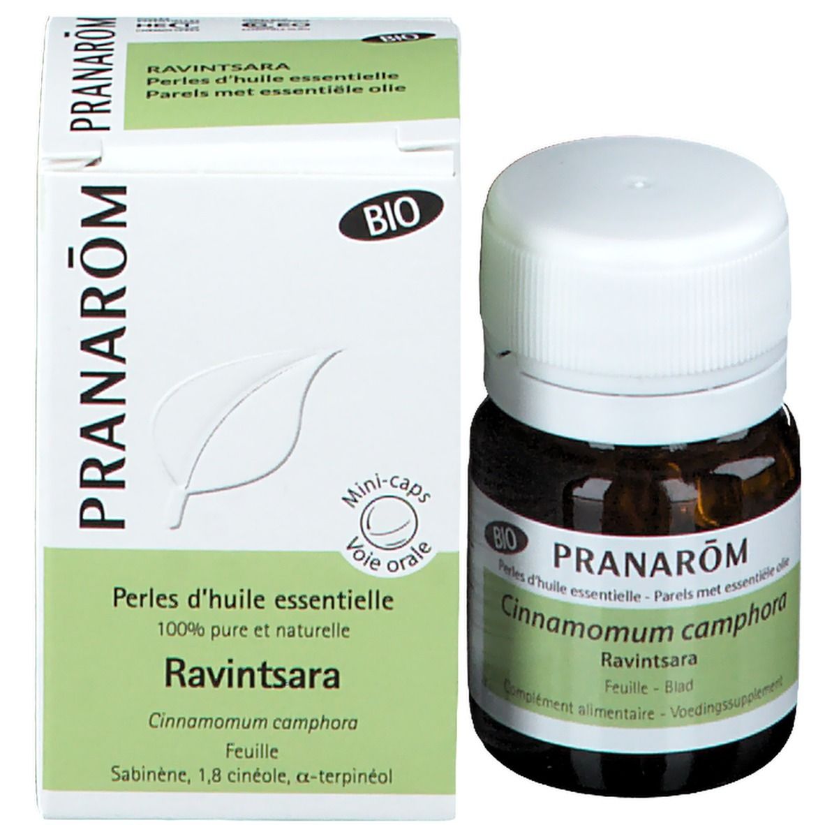 Flacon et emballage. Flacon: verre brun, bouchon blanc. Emballage: blanc, vert. Texte: Pranarôm, Ravintsara, Perles d'huile essentielle.