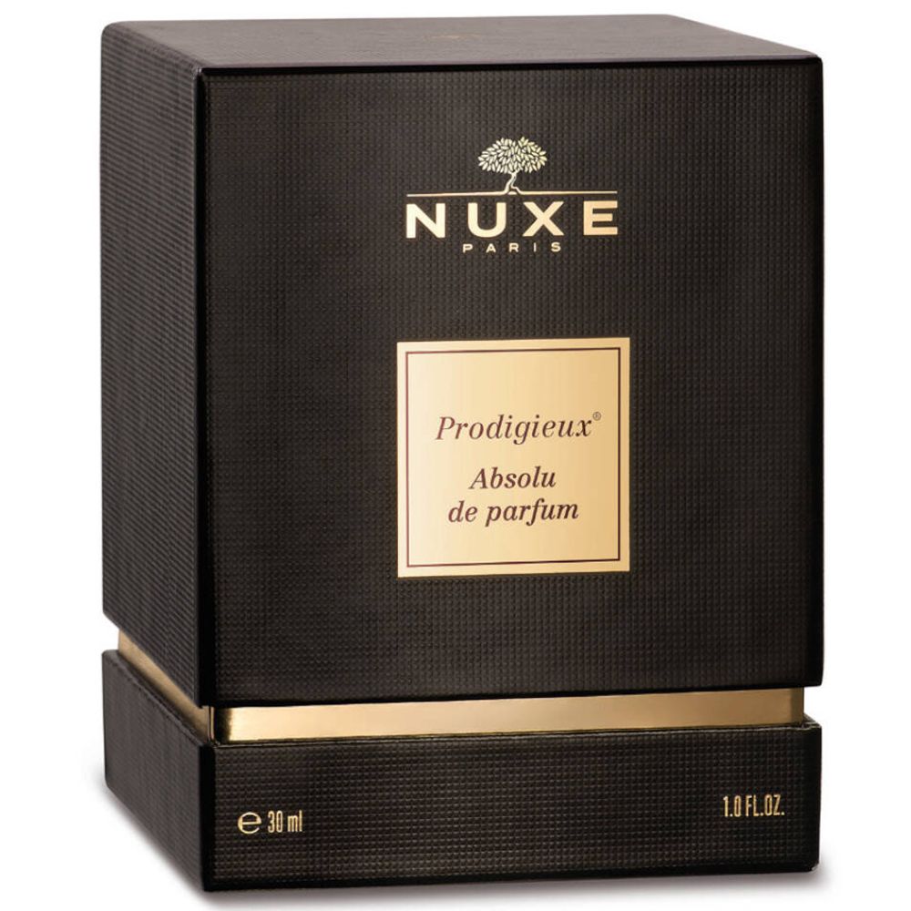 Boîte carrée noire avec détails dorés. Inscription : Nuxe Paris, Prodigieux Absolu de parfum.