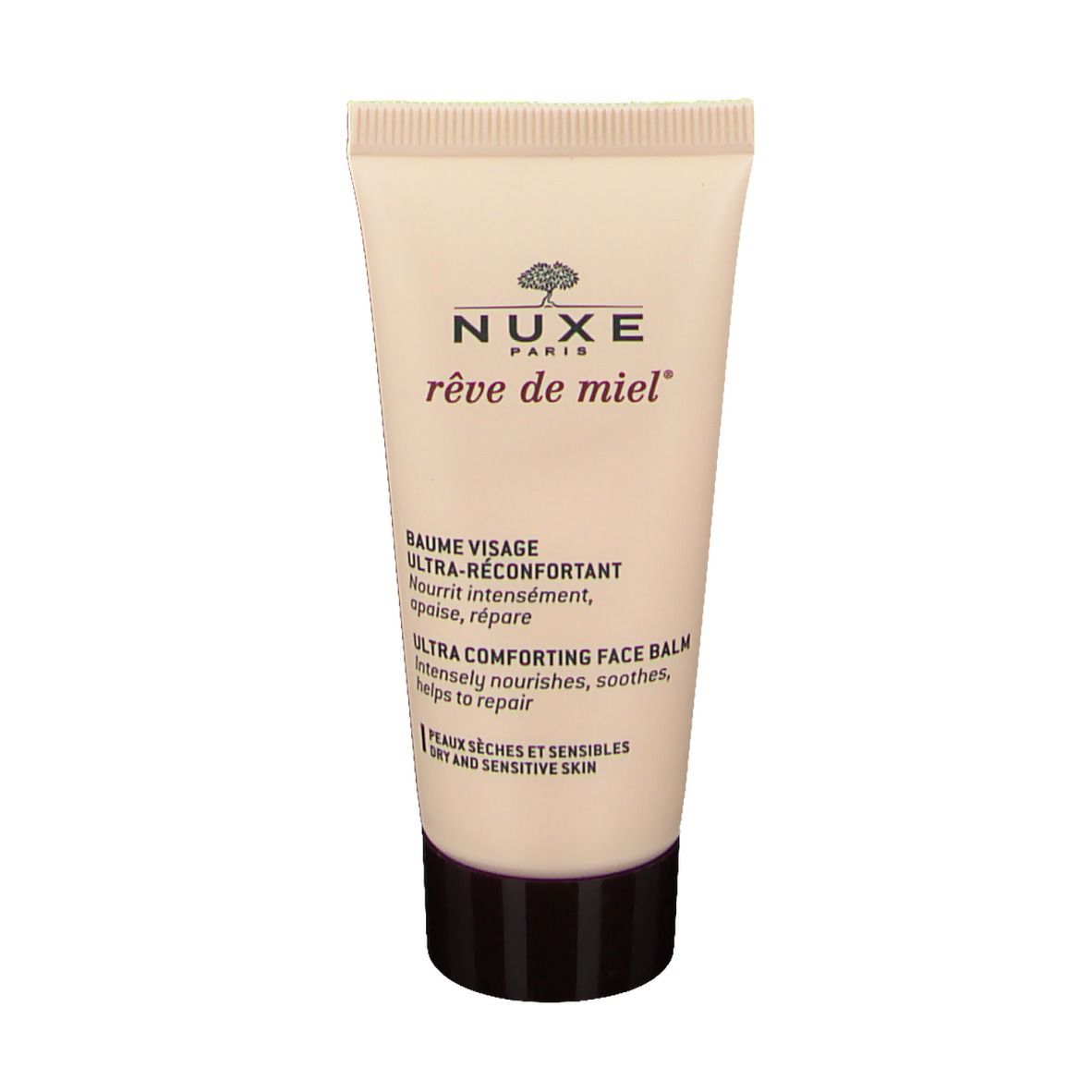 Tube de crème NUXE reve de miel ®. Tube beige avec bouchon marron. Inscriptions en blanc. Baume visage.