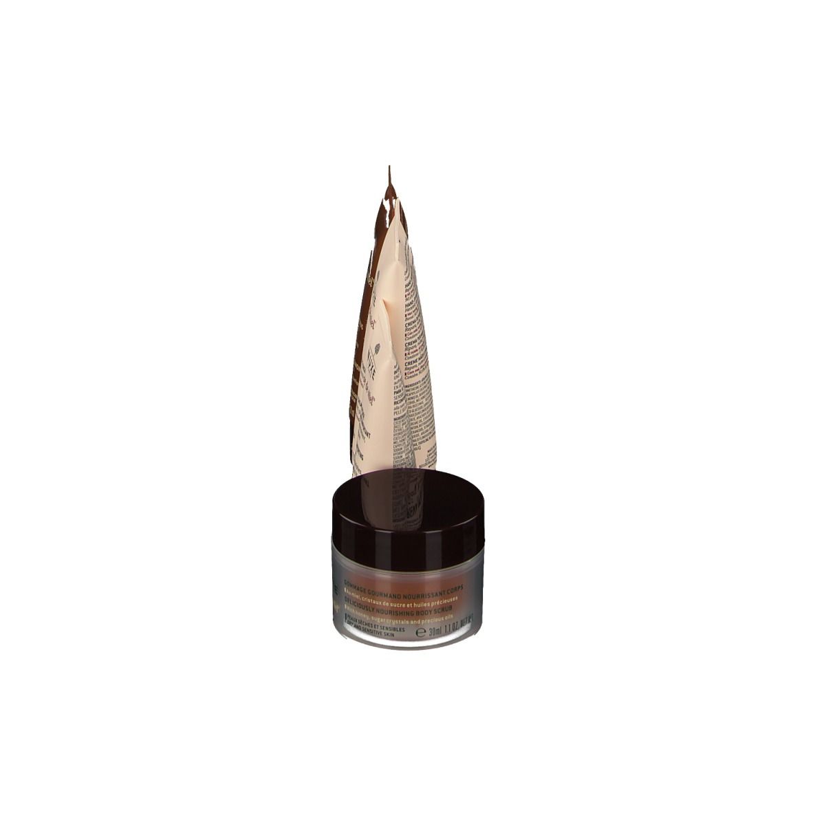 Un pot et un tube. Inscription : Nuxe Rêve de Miel. Emballages bruns et beiges.