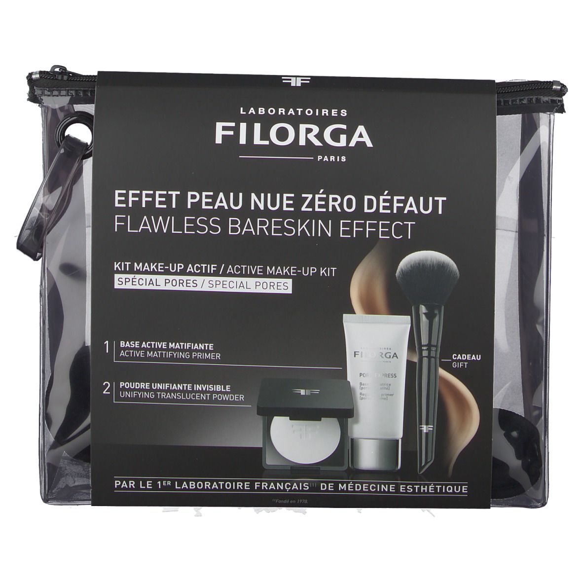 Set de maquillage dans un sac transparent. Contient tube, poudre, pinceau. Inscription Filorga. Sac noir.