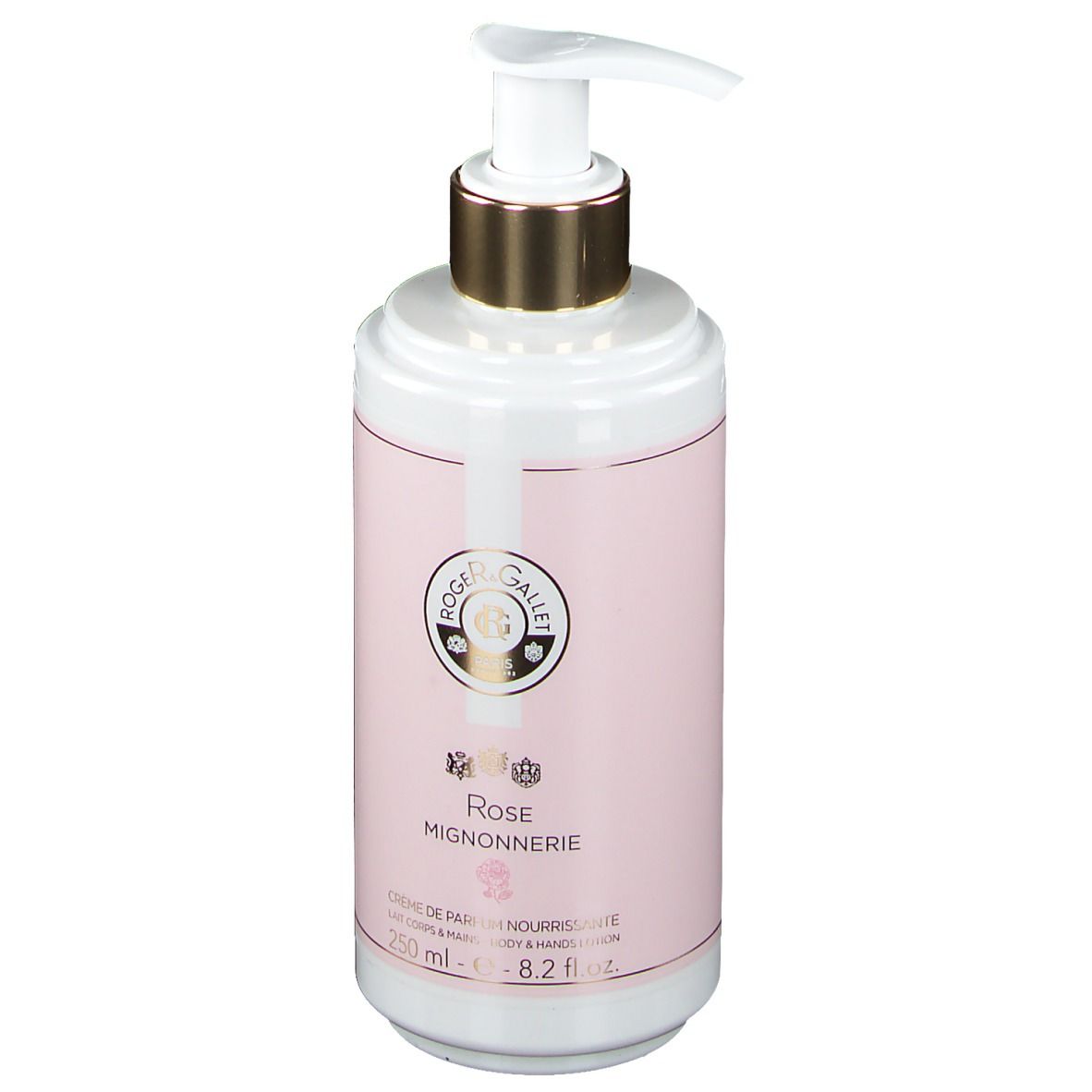 Flacon blanc avec étiquette rose. Tête de pompe dorée. Inscription : Rose Mignonnerie, Crème de Parfum Nourrissante.