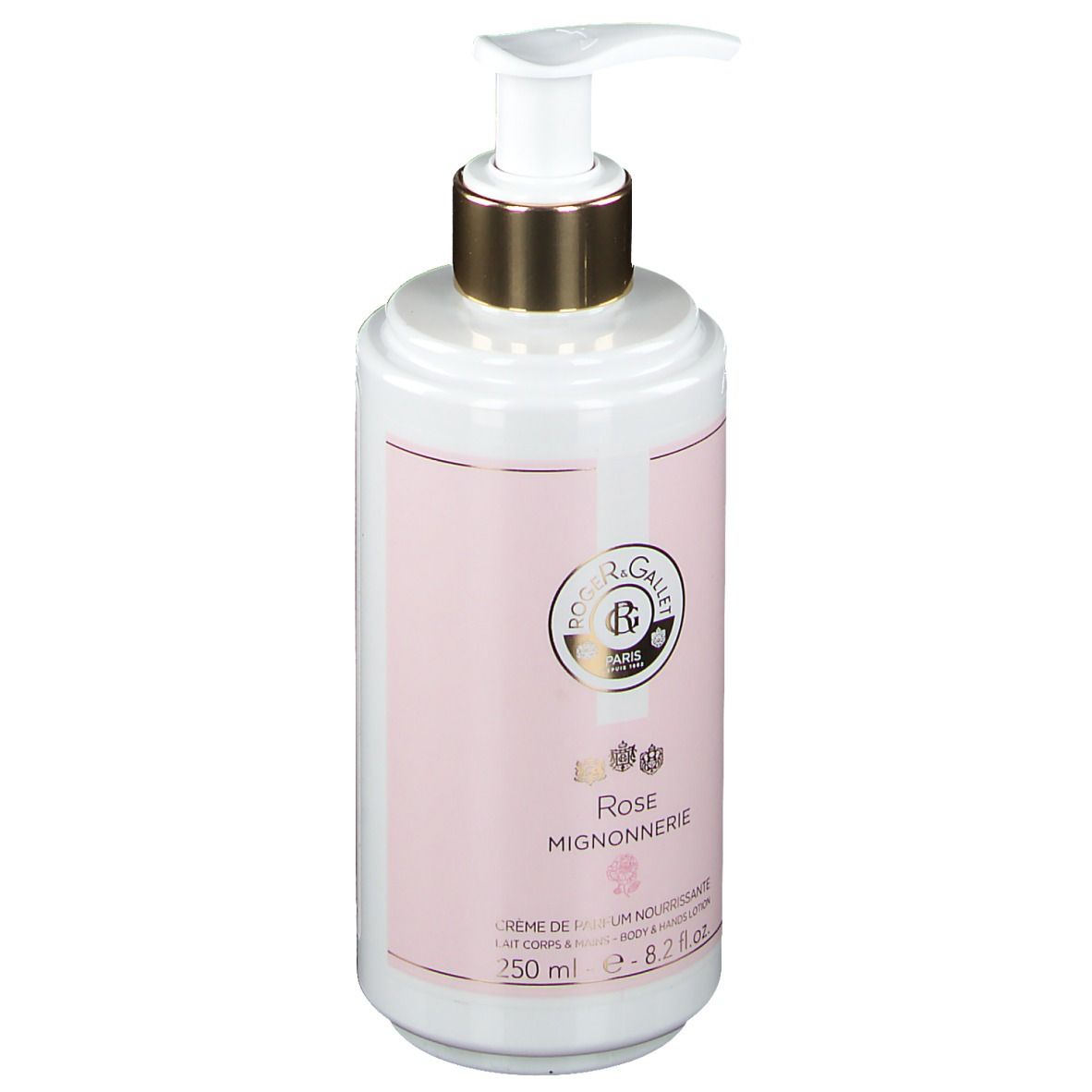 Flacon blanc avec étiquette rose. Tête de pompe dorée. Inscription : Rose Mignonnerie, Crème de Parfum Nourrissante.