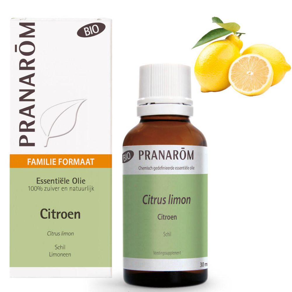 Flacon en verre brun avec bouchon blanc et étiquette. Boîte et citrons à côté.
