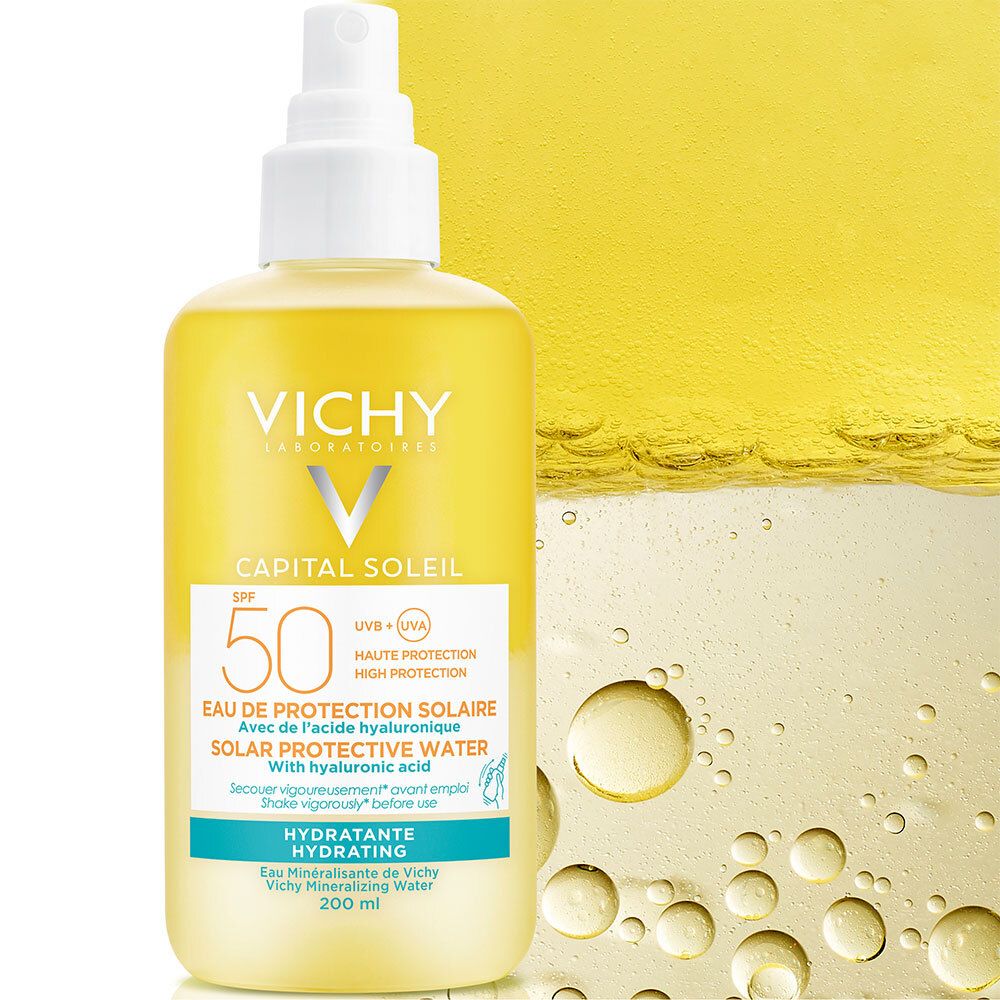 Gele fles met verstuiver. Vichy Capital Soleil SPF50, tekst, water.