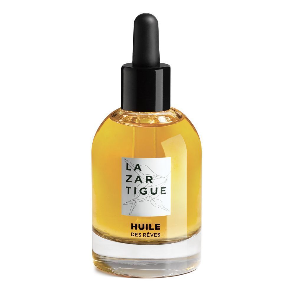 Glazen fles met gele olie, zwarte dop en pipet. Opschrift: LAZARTIGUE, HUILE DES RÊVES.