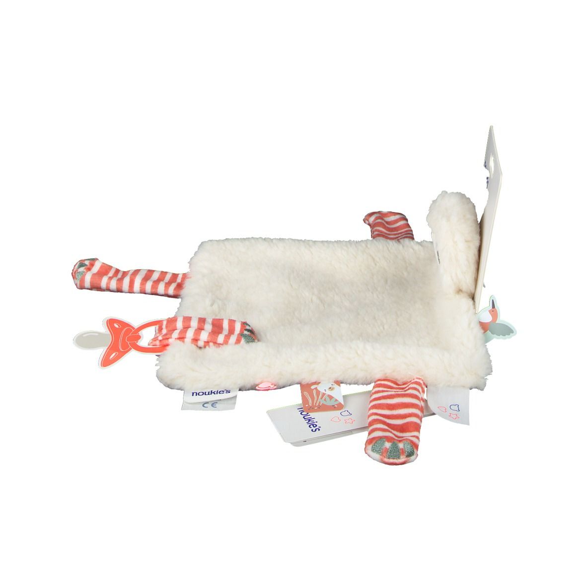 Doudou, vue latérale. Fourrure blanche, rayures rouges sur les bras et les jambes, avec étiquettes et emballage.