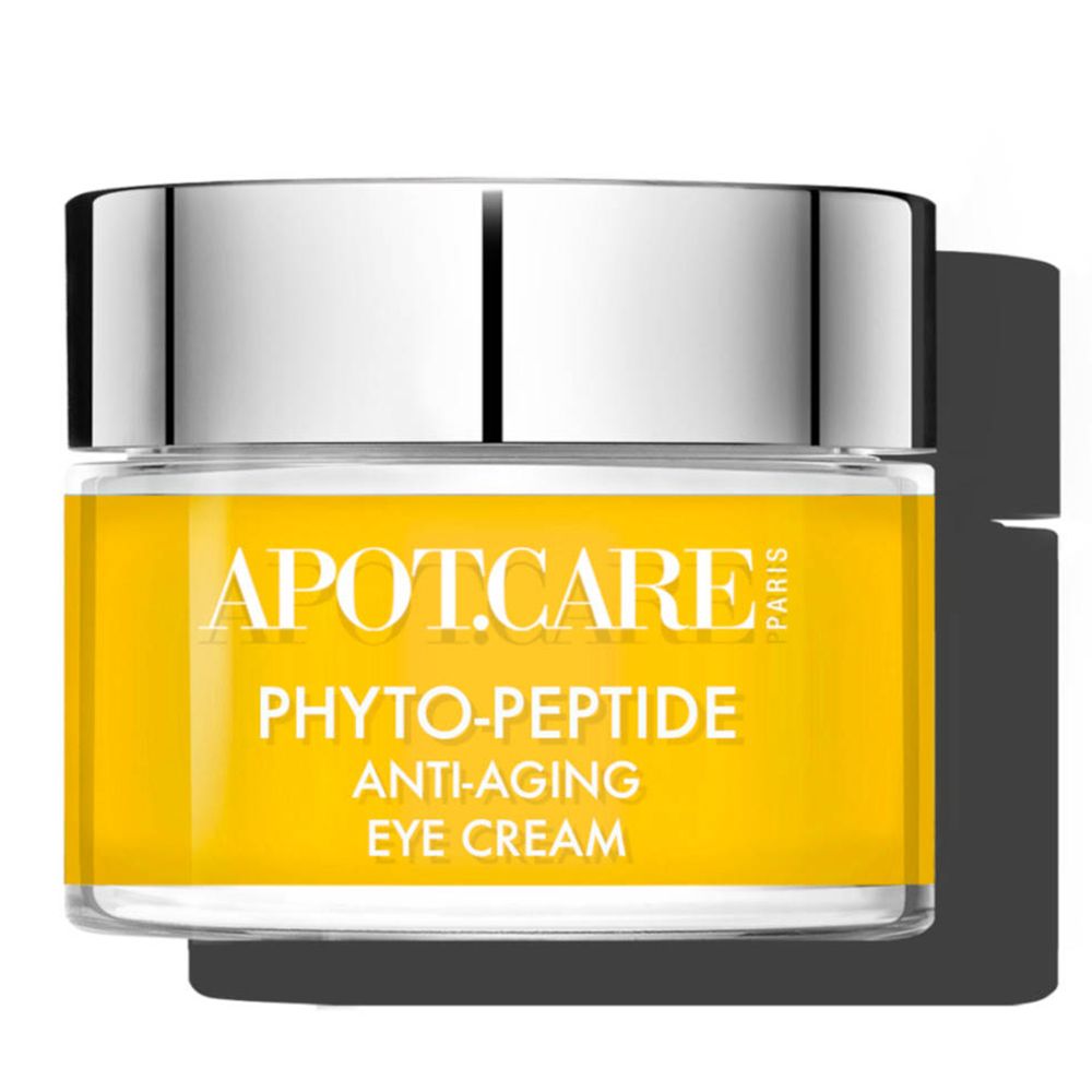 Pot de crème pour les yeux avec couvercle argenté. Récipient jaune avec texte blanc APOT.CARE, PHYTO-PEPTIDE, ANTI-AGING EYE CREAM.