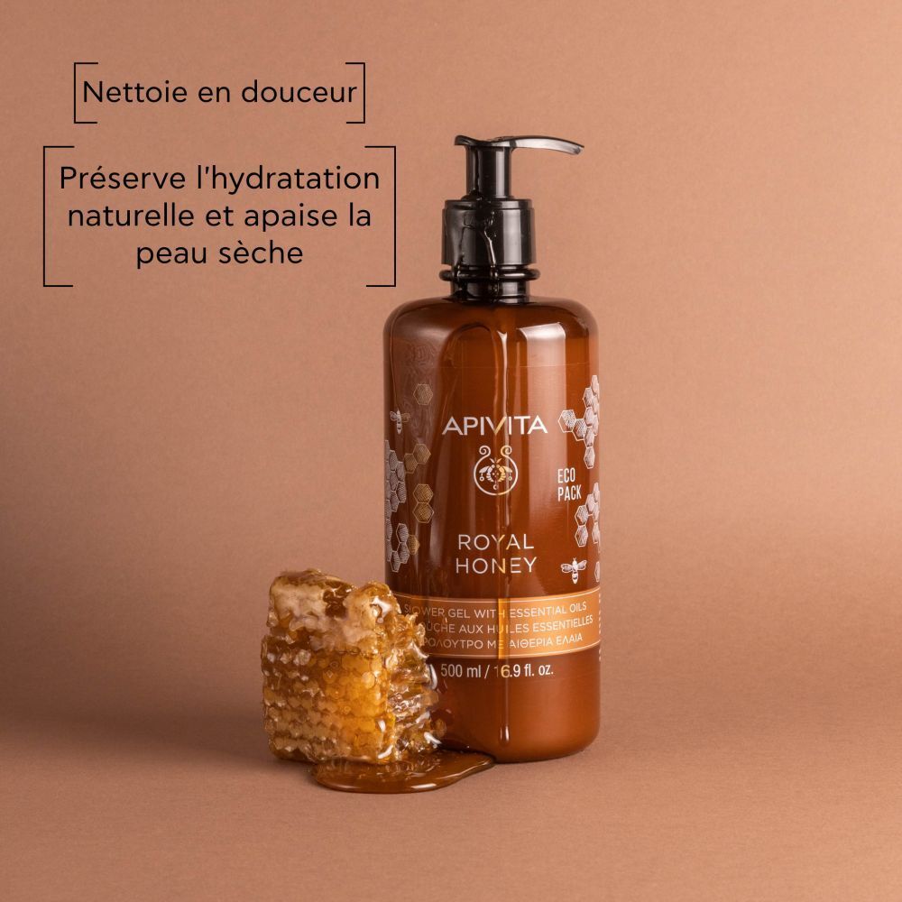 Flacon marron avec pompe noire. Rayon de miel à côté. Texte: Nettoie en douceur. APIVITA ROYAL HONEY.
