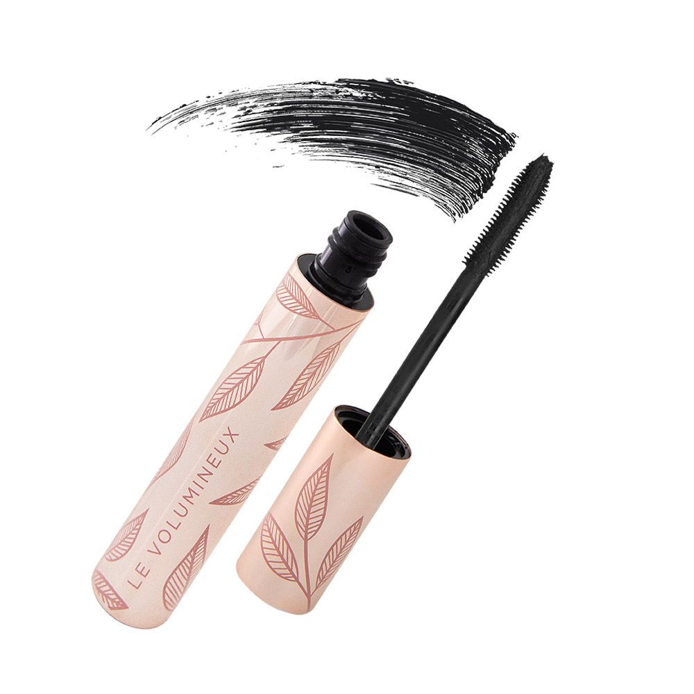 Tube de mascara avec brosse et trace de couleur. Design rose doré. Brosse et couleur noires.