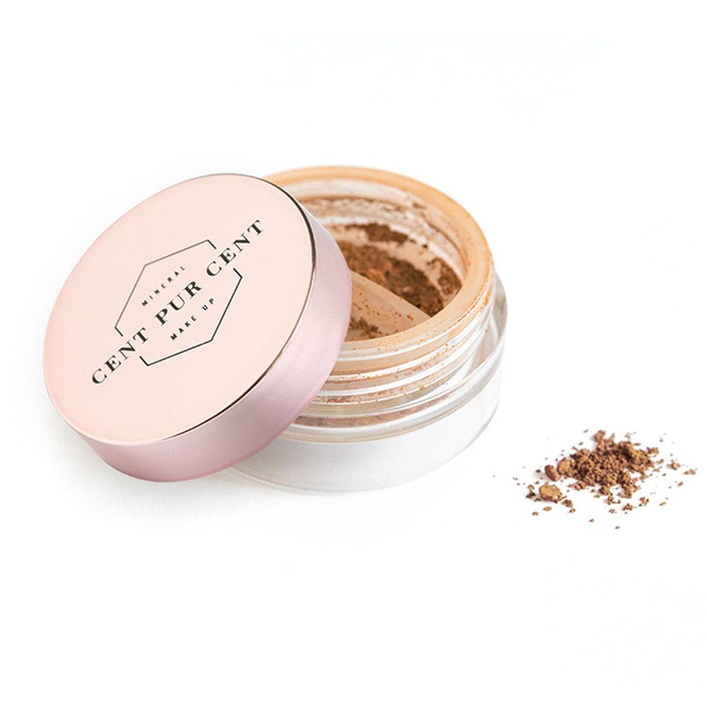 Pot ouvert avec fard à paupières marron. Couvercle rose avec logo. Fard à paupières à côté.