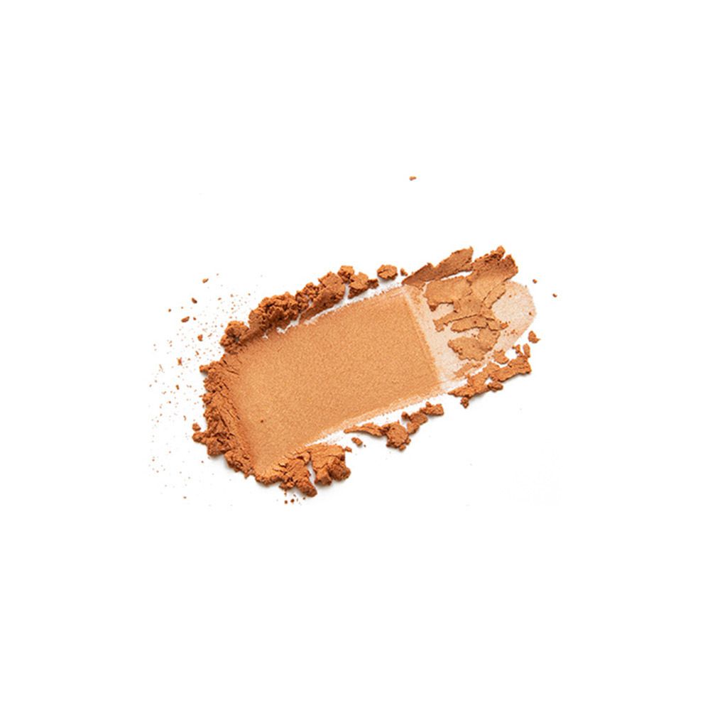 Échantillon de fard à paupières sur fond blanc. Couleur marron.