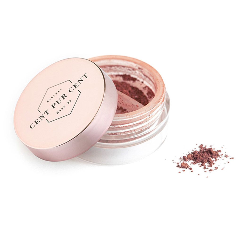 Open, transparante pot met roze oogschaduw. Een hoopje oogschaduw ernaast. "CENT PUR CENT" staat op de deksel.