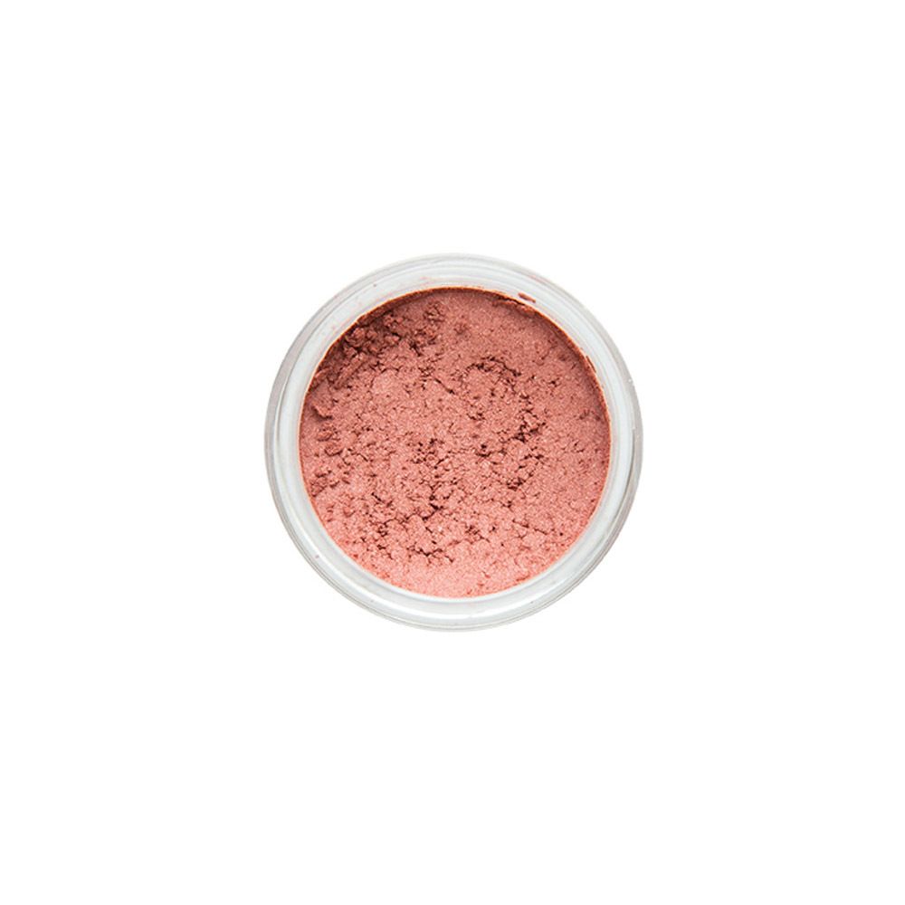Bovenaanzicht van een ronde, transparante pot met roze oogschaduwpoeder.