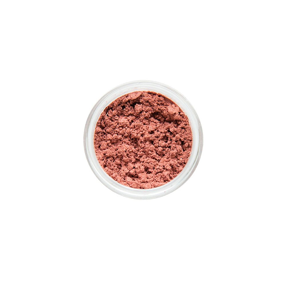 Bovenaanzicht van een ronde, transparante pot met roze oogschaduwpoeder.