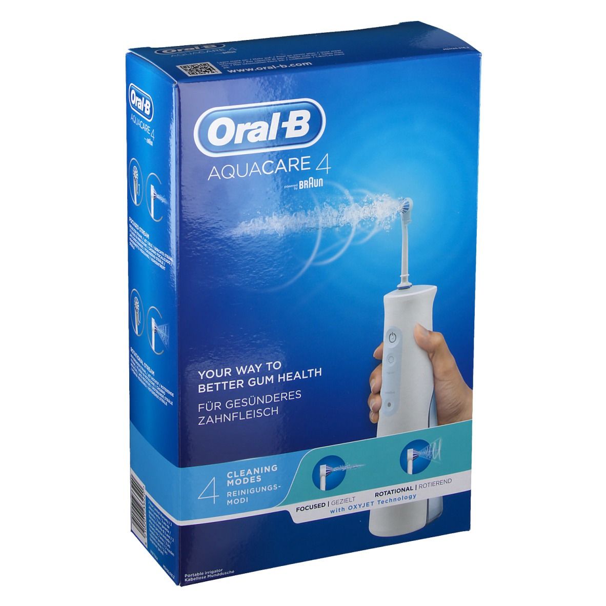 Emballage Oral-B Aquacare 4. Sur fond bleu, un appareil d'irrigation oral blanc est présenté. Texte : « Your way to better gum health » et « 4 modes de nettoyage ».