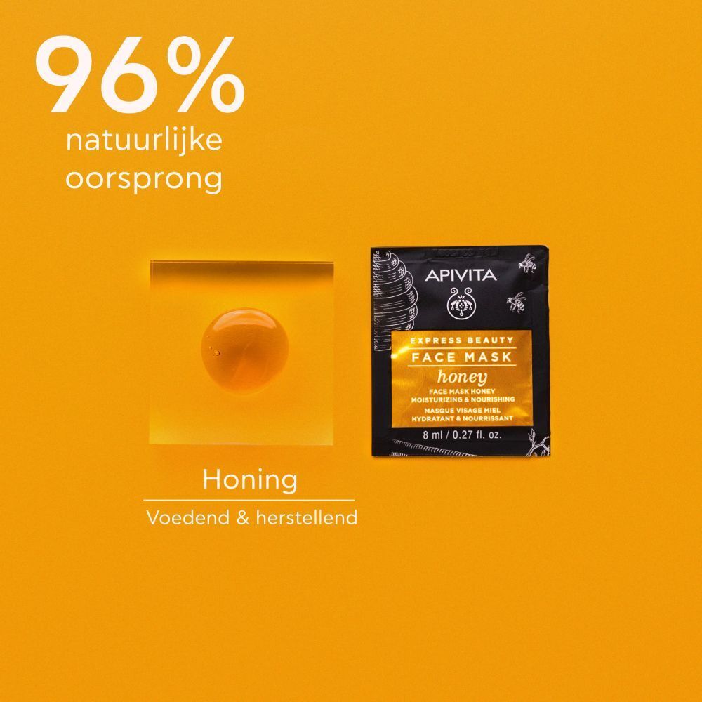 Zakje gezichtsmasker en honing op gele achtergrond. Opschrift: Apivita Express Beauty Face Mask Honey. 8 ml / 0.27 fl. oz.