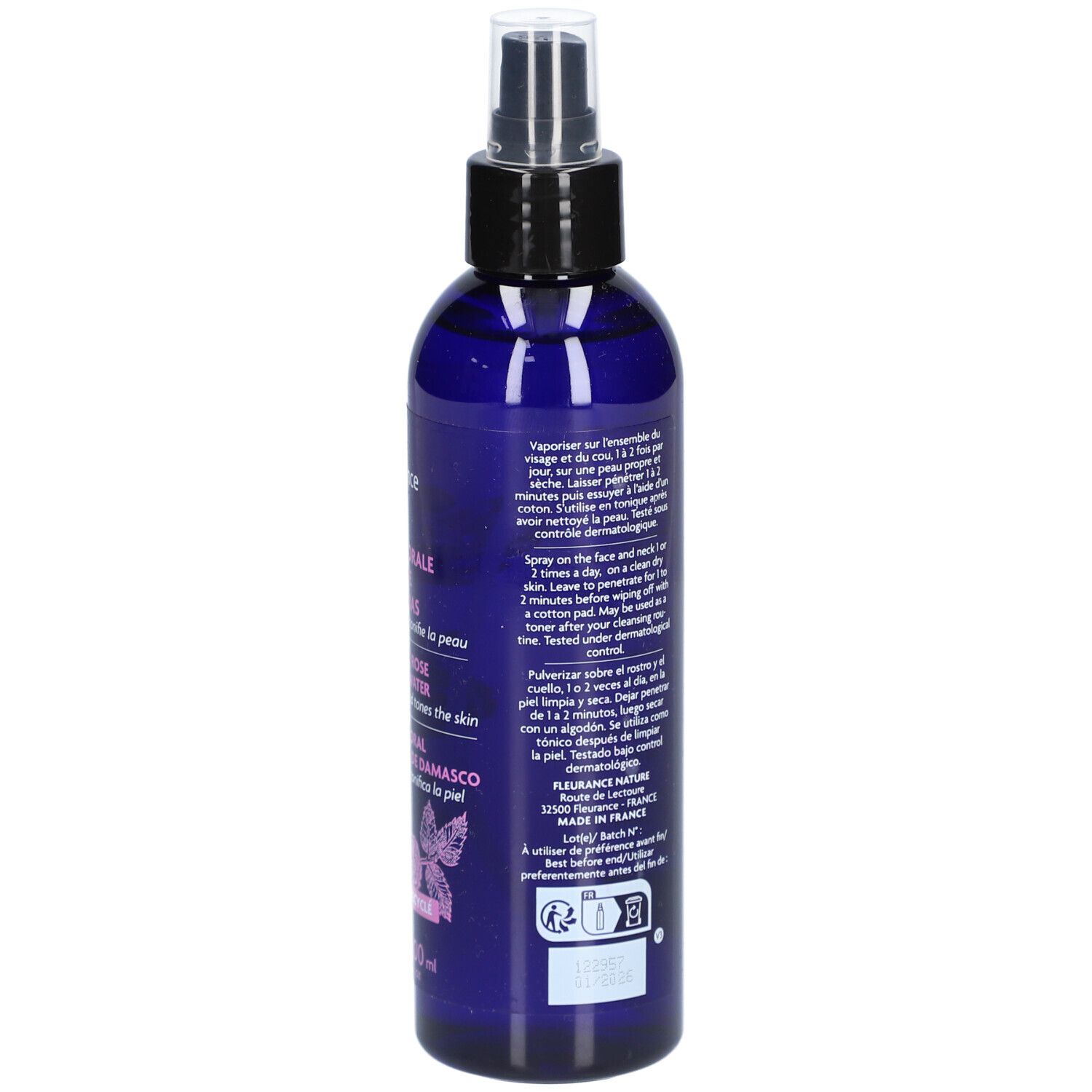 Achterkant van de blauwe fles. Gebruiksaanwijzing en Bio-certificering. Bloemenontwerp.