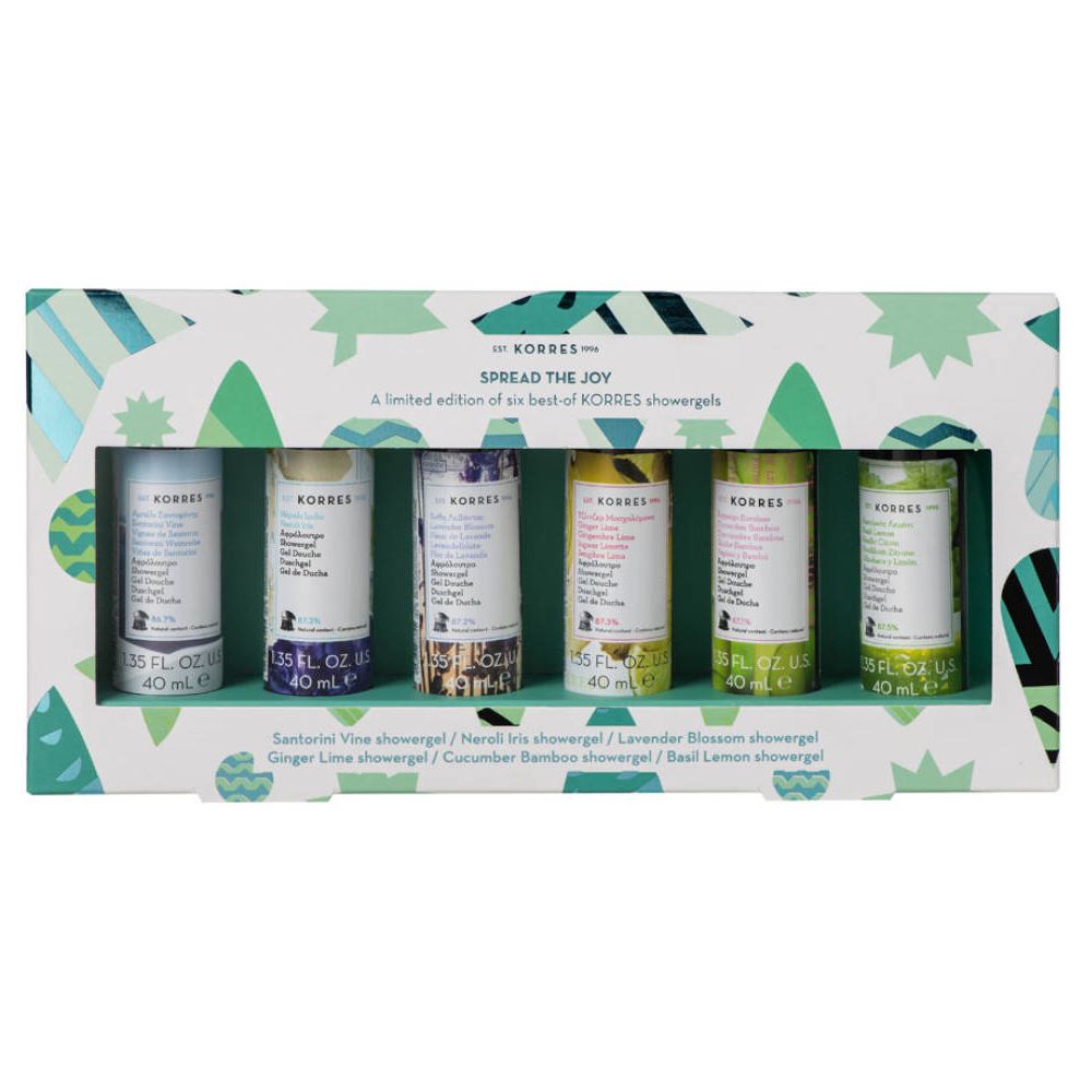 Coffret cadeau de six gels douche Korres. Chaque gel a une couleur et une étiquette différentes. Boîte blanche avec motifs verts.