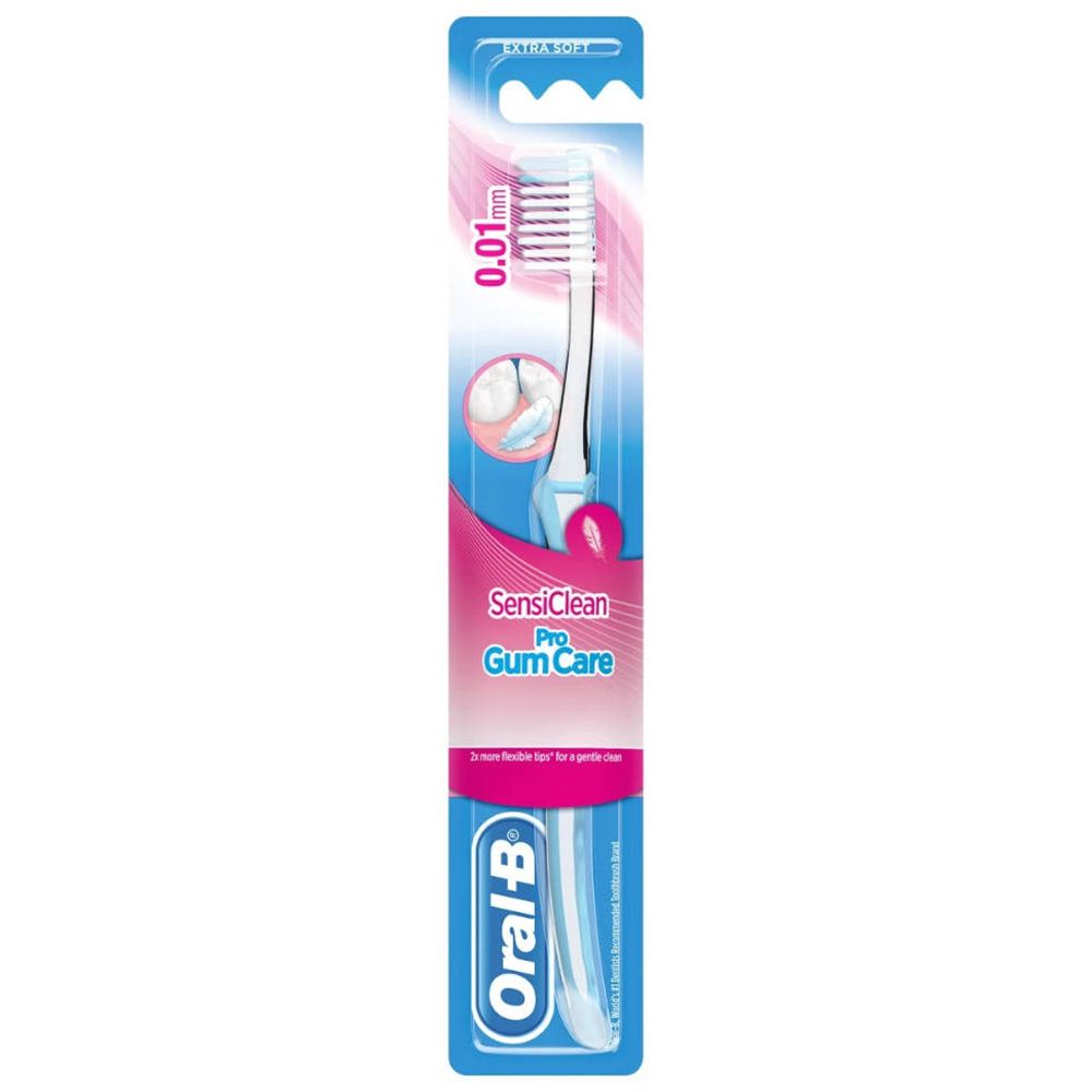 Zahnbürste in Blisterverpackung. Weißer Bürstenkopf mit rosa und blauen Akzenten. Oral-B-Logo unten.