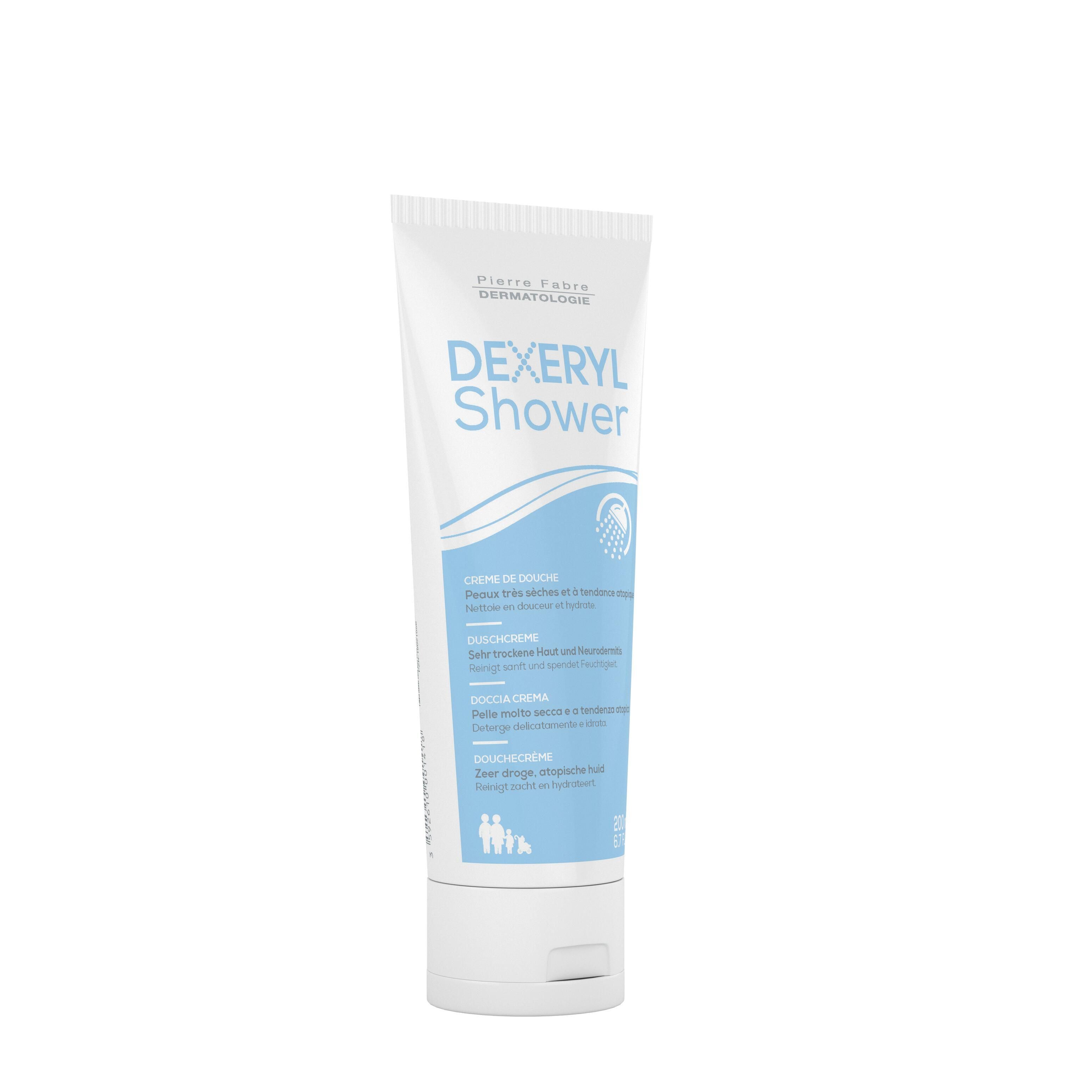 Tube blanc avec inscription bleue DEXERYL Shower. Nom du produit et logo du fabricant. Inscription "Crème de douche".