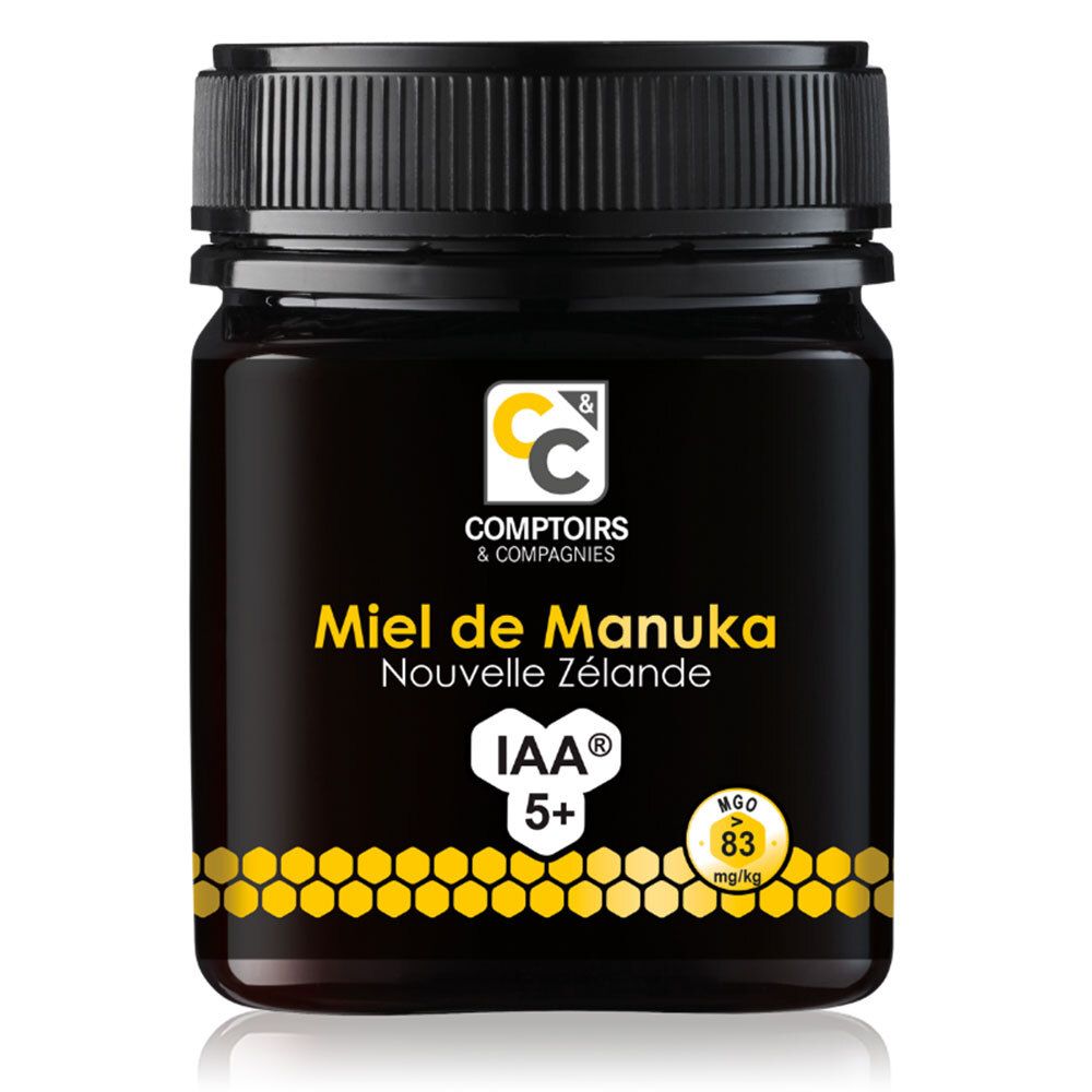 Pot de miel avec couvercle noir. Étiquette avec informations produit. IAA 5+ et MGO 83 mg/kg.