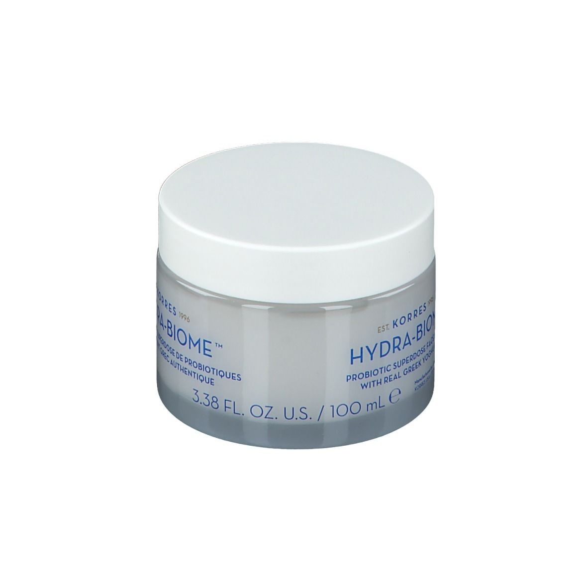 Pot rond transparent avec couvercle blanc. Inscription : HYDRA-BIOME, Probiotic superdose with real greek yoghurt, 3.38 fl. oz. U.S. / 100 ml.