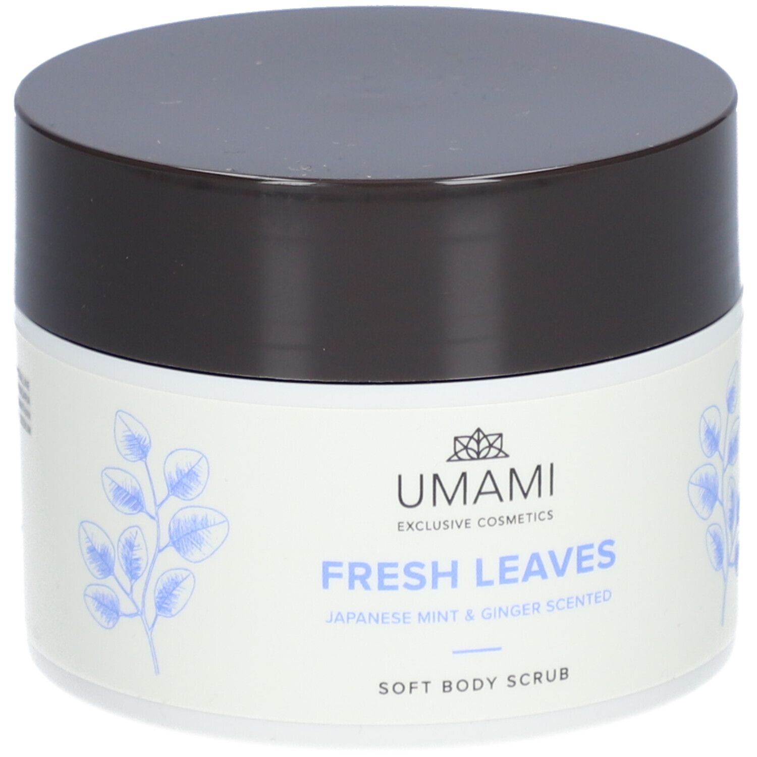 Pot blanc avec couvercle marron. Inscription : UMAMI, FRESH LEAVES, Japanese Mint & Ginger Scented, Soft Body Scrub.