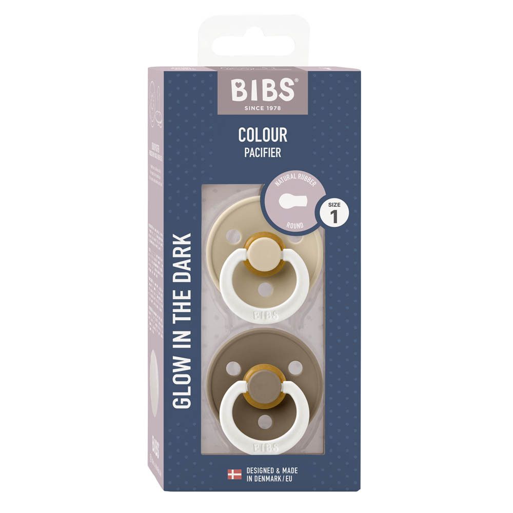 Emballage de deux sucettes. Logo BIBS, 'COLOUR PACIFIER'. Taille 1. Brille dans le noir.