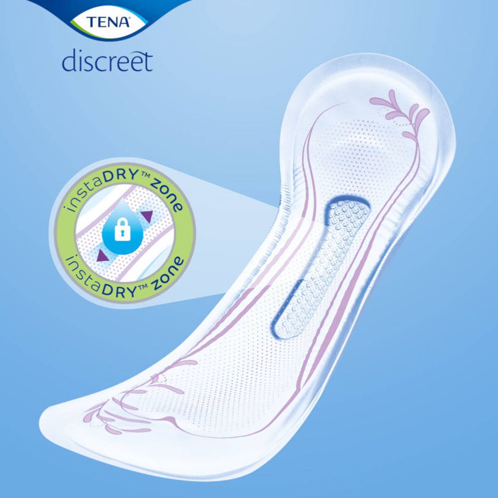 TENA Discreet Extra Plus. Product met instaDRY zone. Roze en blauwe details. Close-up.