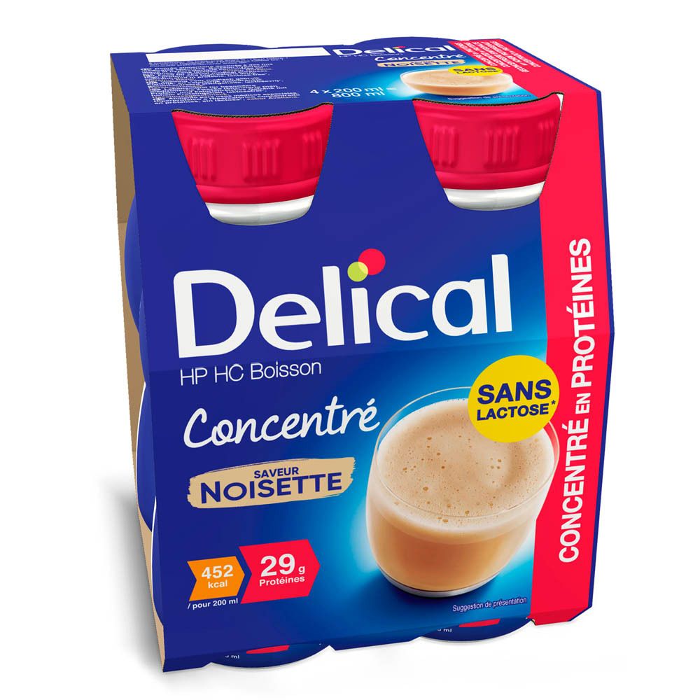 Emballage de quatre bouteilles Delical HP HC Boisson Concentré Noisette. Emballage bleu, bouchons rouges, texte : Sans Lactose, 29g protéines.