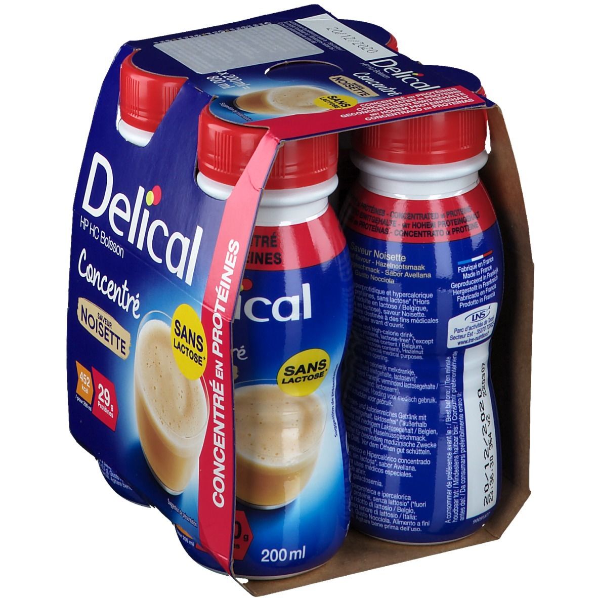 Emballage de quatre bouteilles Delical HP HC Boisson Concentré Noisette. Emballage bleu, bouchons rouges, texte : Sans Lactose, 29g protéines.