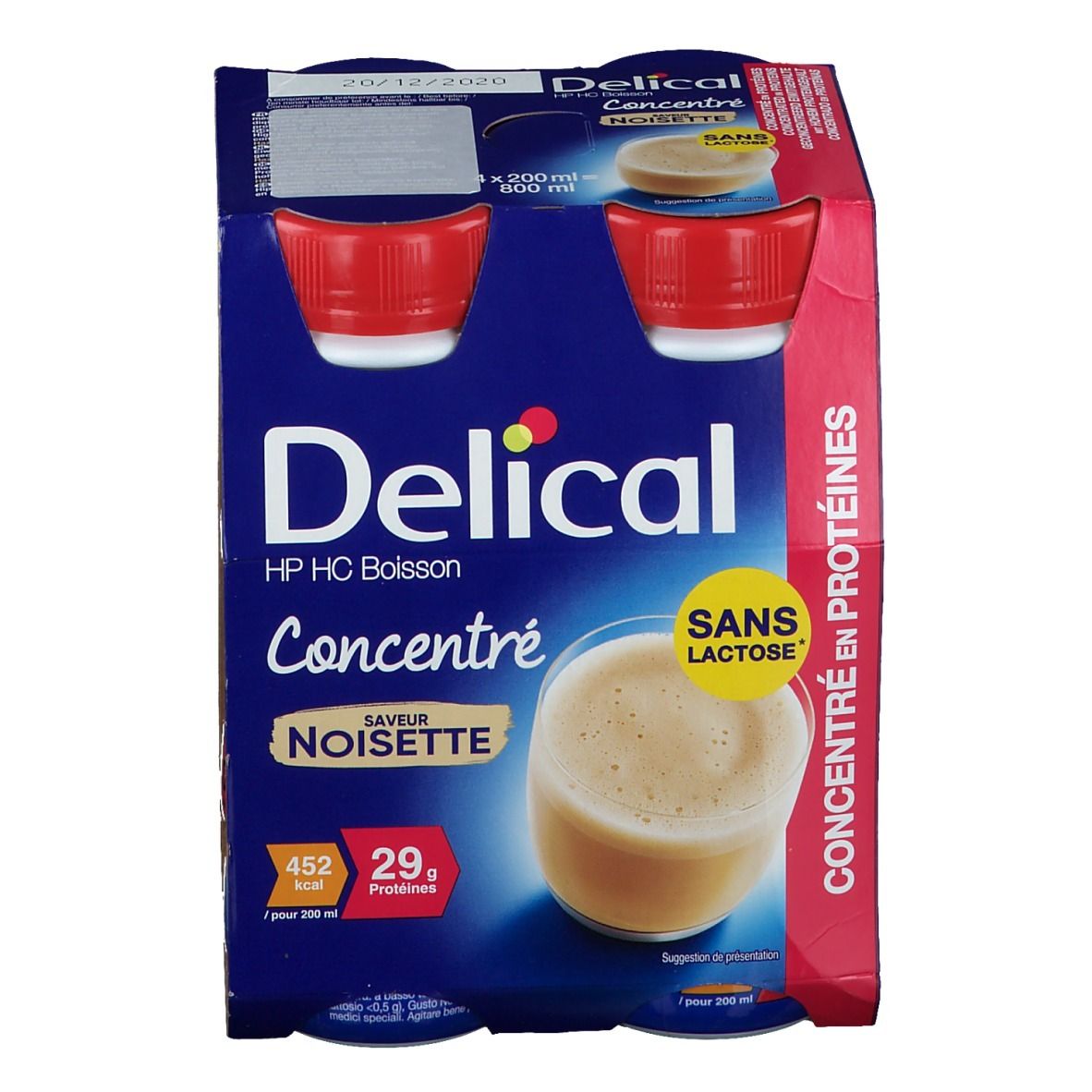 Emballage de quatre bouteilles Delical HP HC Boisson Concentré Noisette. Emballage bleu, bouchons rouges, texte : Sans Lactose, 29g protéines.