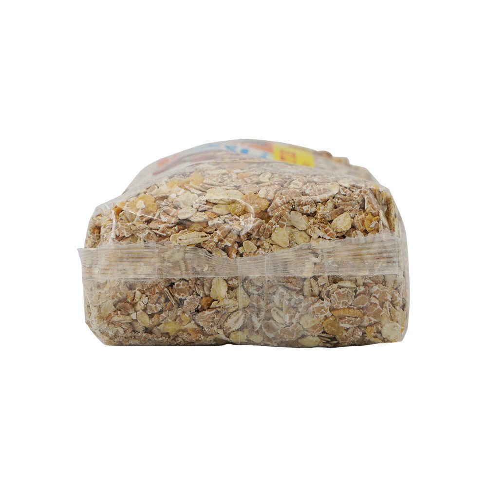 Bovenaanzicht van de muesliverpakking. Transparante folie, gevuld met muesli. Gesloten.