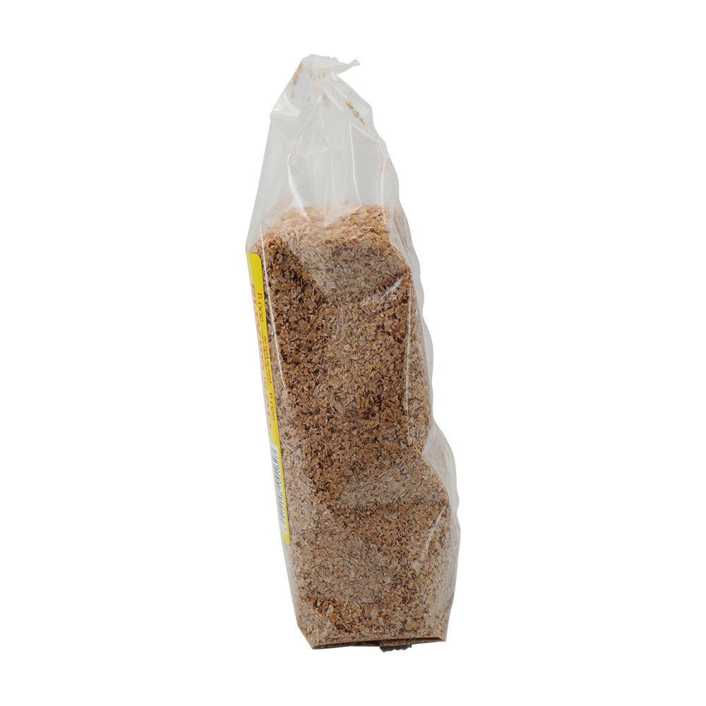 Schuine zijaanzicht van de transparante verpakking met Damhert Fibre Fit Weizenkleie BIO. Inhoud zichtbaar.