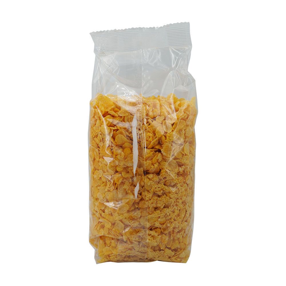 Transparante verpakking met cornflakes. Zicht op de gele vlokken. Verpakking gesloten.