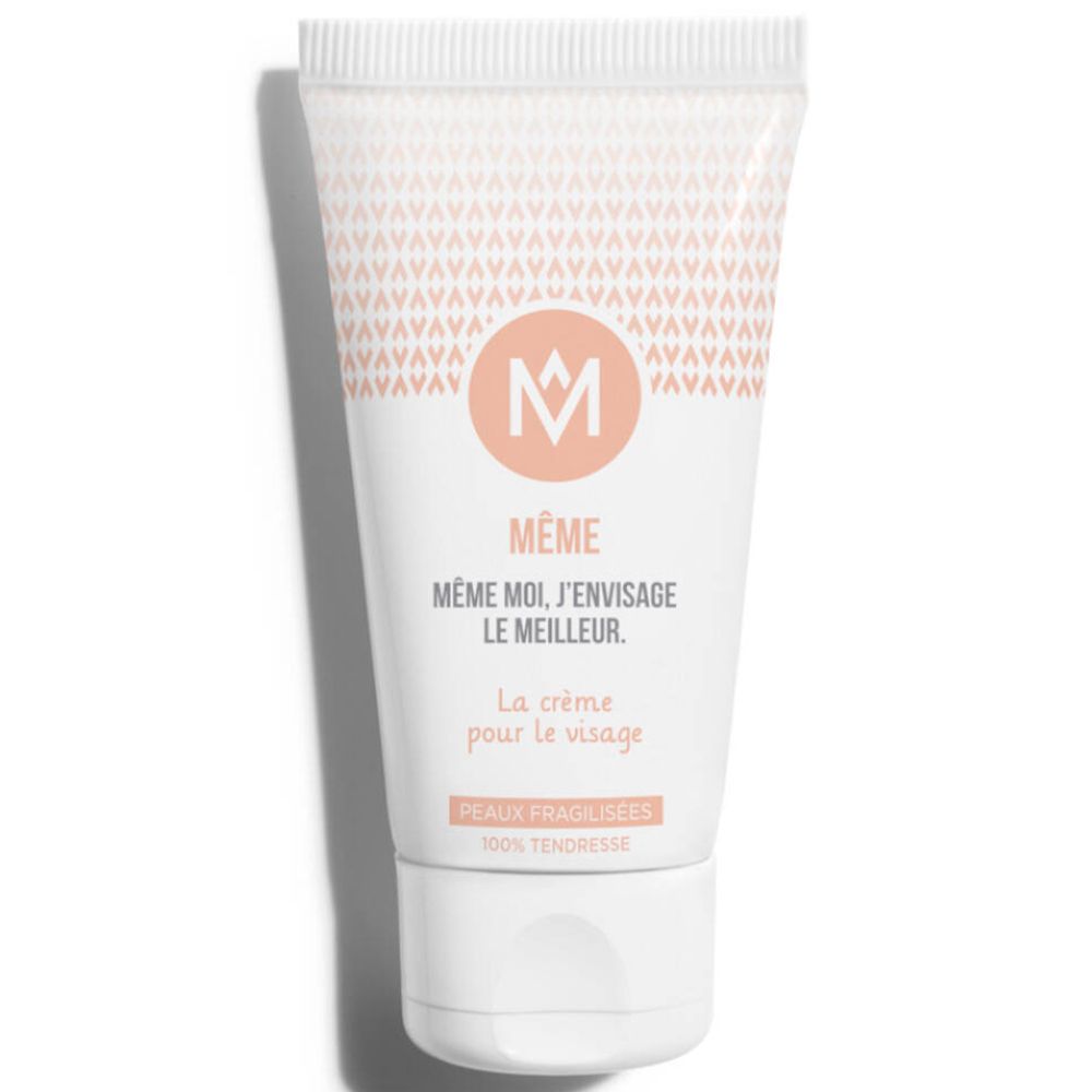 Witte crème tube met MÊME logo en productinformatie. Opschrift: La crème pour le visage. Peaux fragilisées.