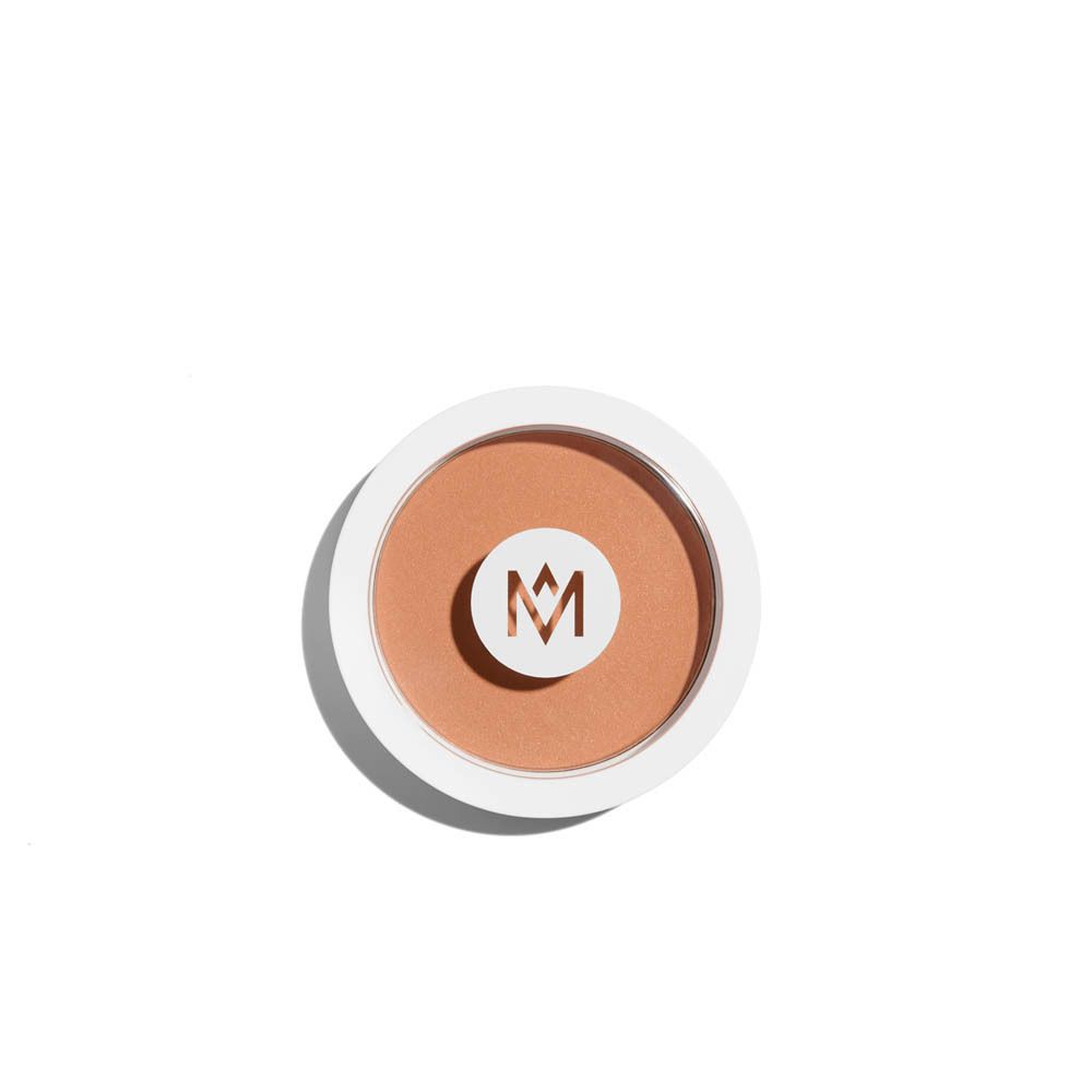 Ronde poederdoos, wit, met deksel. Beige poeder. Logo: M.