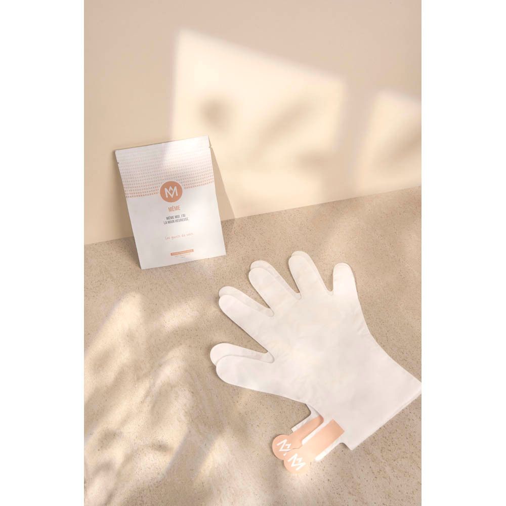 Gant et emballage avec logo MÊME. Inscription: MÊME MOI, J'AI LA MAIN HEUREUSE. Les gants de soin. Sur fond beige.